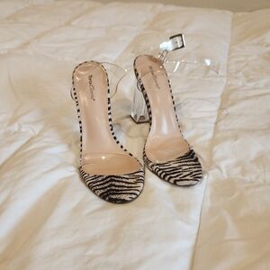 Torta Caliente Zebra Print Clear Block Heel Sandals.